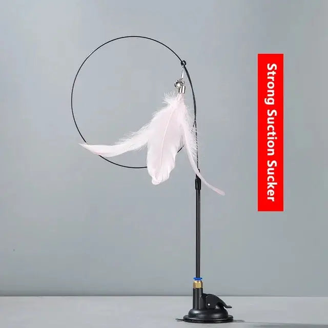 Cat Teaser Stick With Bell Extended Rod featuring feather attachments in pink, white, and black. Includes a suction base for hands-free play.