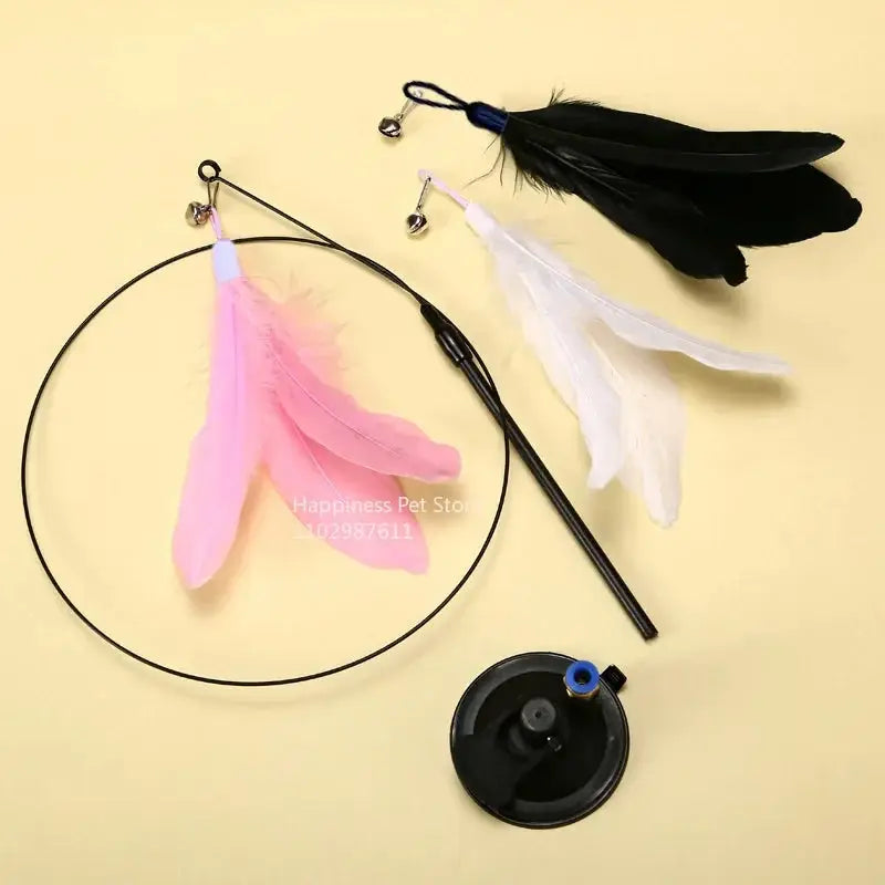 Cat Teaser Stick With Bell Extended Rod featuring feather attachments in pink, white, and black. Includes a suction base for hands-free play.